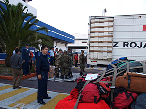 Ecuadorian army personnel gather up items to ship to Haiti. 